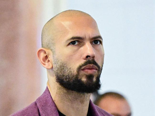 (FILES) Andrew Tate (L) and his brother Tristan Tate are pictured inside The Court of Appeal in Bucharest, Romania, on December 10, 2024. Florida's attorney general said March 4 that a criminal investigation had been opened into self-described misogynist influencer Andrew Tate and his brother, who flew to the US state last week from Romania, where they faced rape and human trafficking charges. (Photo by Daniel MIHAILESCU / AFP)