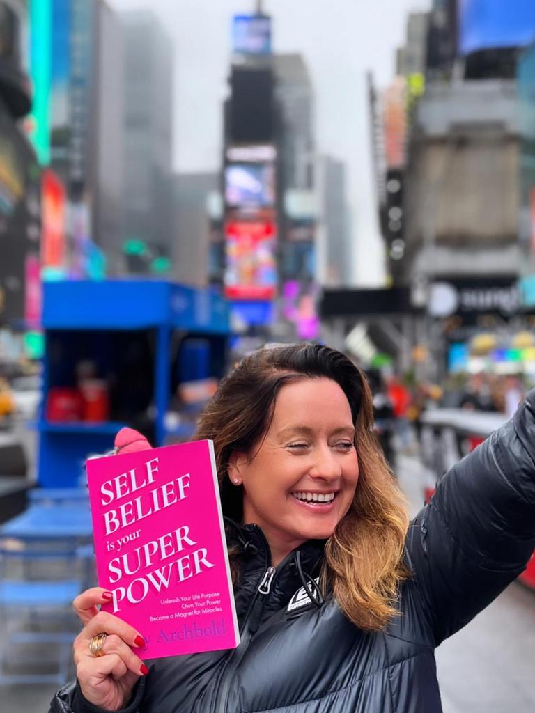 Tory Archbold pictured with her first book, <i>Self-Belief Is Your Superpower</i>. Picture: @powerfulsteps via Instagram