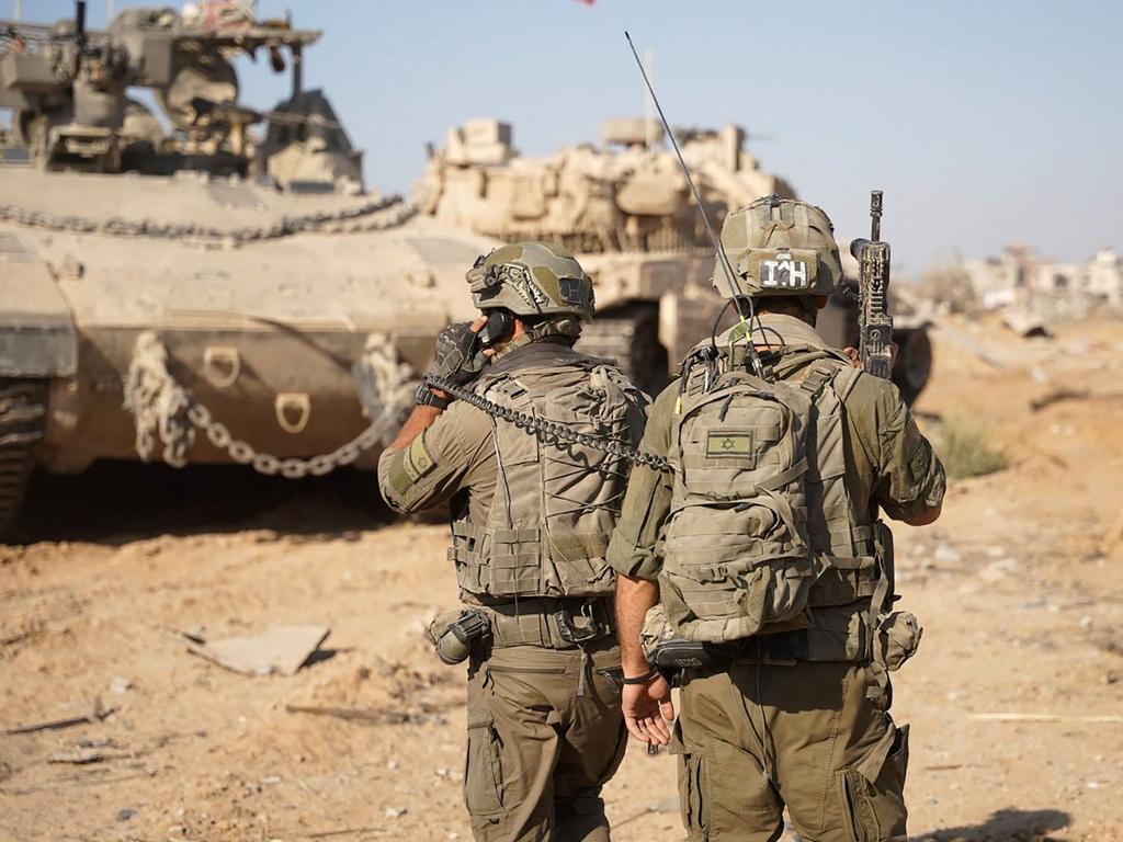 Israeli troops and armoured vehicles operating on the ground in the Gaza Strip amid the continuing conflict between Israel and Hamas. Picture: AFP/ Israeli Army