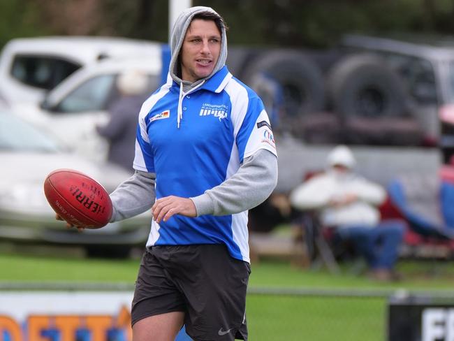 Mark Baguley warming up before his 100th game for Langwarrin. Picture: Paul Churcher