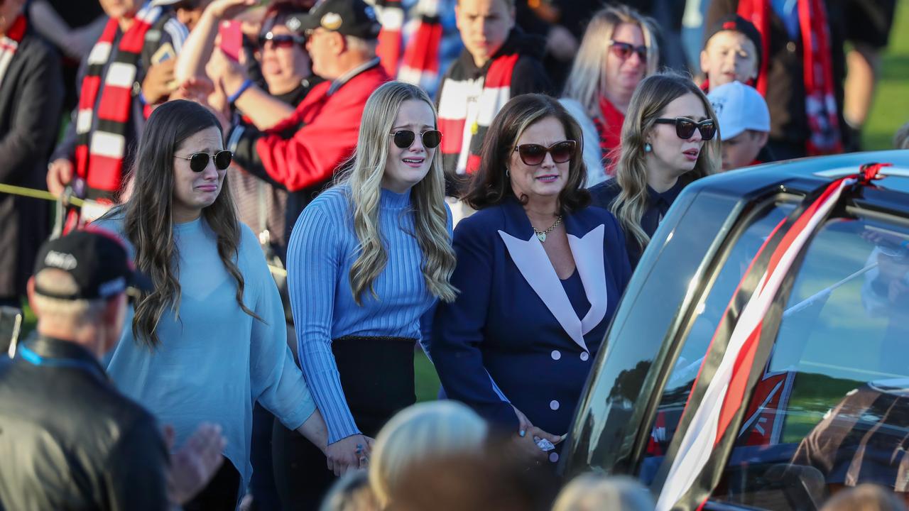 The Frawley family watch as Danny’s hearse does a lap of honour at Moorabbin. Picture: Alex Coppel