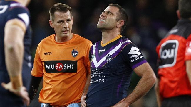 Cameron Smith of the Storm (centre) receives medical attention during the Round 23 NRL match between the Melbourne Storm and the Parramatta Eels at AAMI Park in Melbourne, Friday, August 17, 2018. (AAP Image/Daniel Pockett) NO ARCHIVING, EDITORIAL USE ONLY