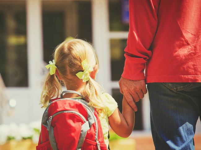 father and little daughter go to school or daycare, education