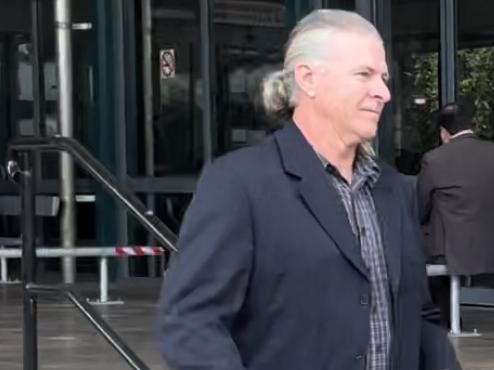 Darren Andrew Kelly walks out of Byron Local Court after being charged with cultivating plants.