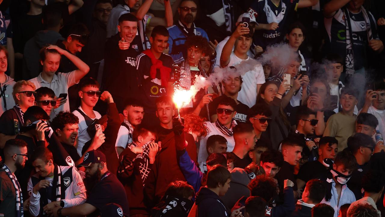 Fans set off flares during the game. Photo by Darrian Traynor/Getty Images.