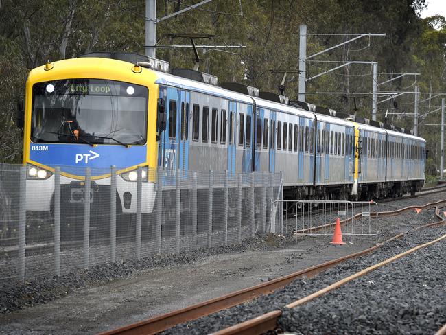 MELBOURNE, AUSTRALIA - NewsWire Photos NOVEMBER 04, 2021: A Metro train runs on the existing track next to the rail duplication project at the Cranbourne rail line in Melbourne's outer south-east. Picture: NCA NewsWire / Andrew Henshaw