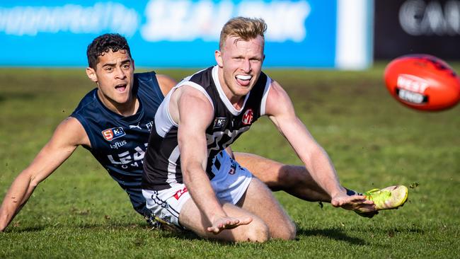 Port Adelaide's Campbell Wildman and South Adelaide's Darnell Tucker (not sure). SANFL game between South Adelaide and Port Adelaide on August 14th, 2022, at Noarlunga Oval.Picture: Tom Huntley