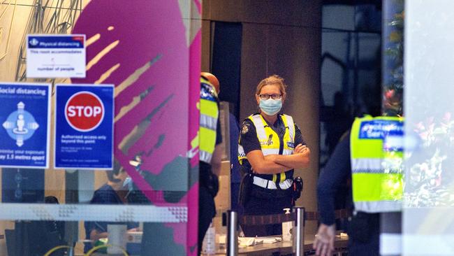 Police at the Novotel Hotel, one of the hotspot hotels designated for quarantining positive COVID cases in Melbourne. Picture: David Geraghty/NCA NewsWire.