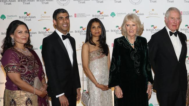 Rishi Sunak and his wife Akshata Murthy, centre, with King Charles and his wife Camilla and former Home Secretary Priti Patel, far left.