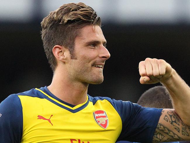 Arsenal's French striker Olivier Giroud waves to fans after the final whistle during the English Premier League football match between Everton and Arsenall at Goodison Park in Liverpool, northwest England on August 23, 2014. The match ended in a 2-2 draw after Everton led 2-0 at half-time. AFP PHOTO / LINDSEY PARNABY RESTRICTED TO EDITORIAL USE. No use with unauthorized audio, video, data, fixture lists, club/league logos or “live” services. Online in-match use limited to 45 images, no video emulation. No use in betting, games or single club/league/player publications.