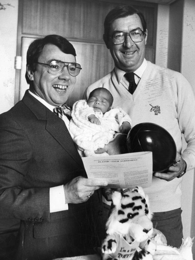 Glenelg football club director Harry Kernahan at the Queen Victoria hospital with winemaker Wolf Blass and the club's latest "signing" Wolf's new born baby son Anton, 24 in 1984.