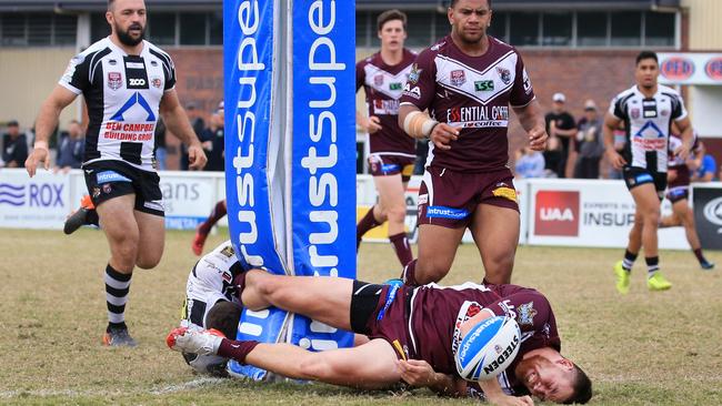 Wells collides with a goalpost during Burleigh’s Round 16 win over Tweed Heads at Pizzey Park. Picture: SMP Images