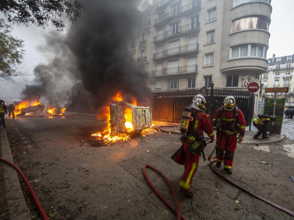 Emergency services put out fires that burned throughout Paris. Picture: Getty