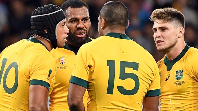 Australia's Christian Lealiifano (L), Marika Koroibete (2/L), Kurtley Beale (2/R) and James O'Connor (R) chat during the Japan 2019 Rugby World Cup Pool D match between Australia and Fiji at the Sapporo Dome in Sapporo on September 21, 2019. (Photo by WILLIAM WEST / AFP)