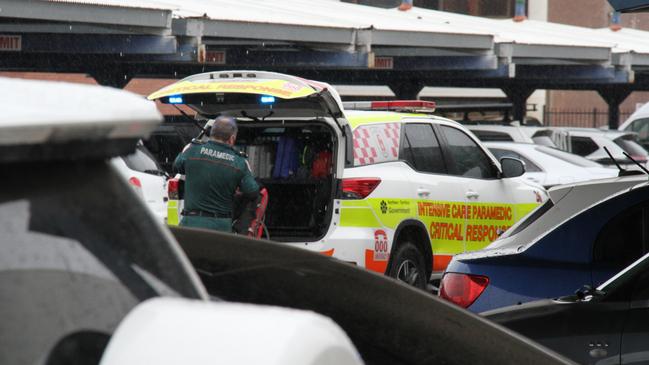 A paramedic outside Coles in Alice Springs. A man has died inside Alice Springs Coles on May 27, 2025, with police saying he was in custody at the time. Picture: Gera Kazakov