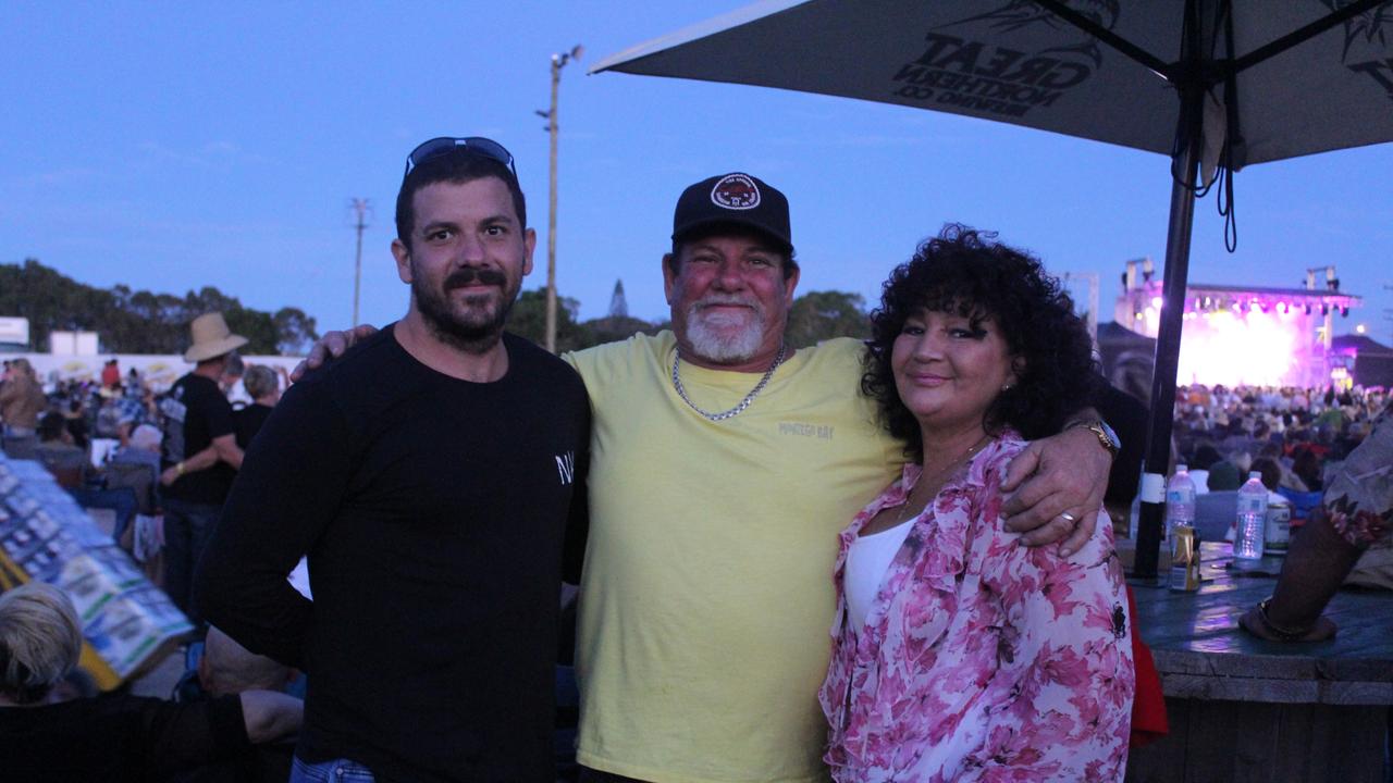 SOUNDS OF ROCK: Bradley. Nicko and Cath Healy having a great night at the festival.