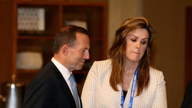 Man in the middle ... Tony Abbott and Peta Credlin at a meeting in Bali.