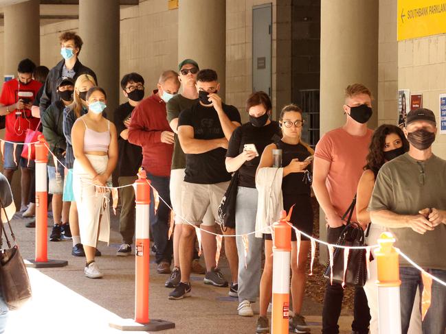 People queue for vaccination at the Brisbane Convention and Exhibition Centre yesterday. Picture: Liam Kidston