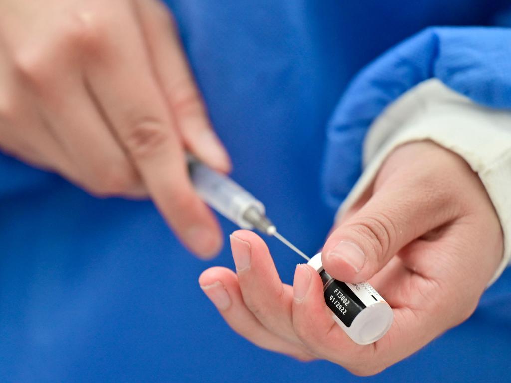 A health worker prepares a dose of the Pfizer vaccine. Picture: Pedro Pardo/AFP