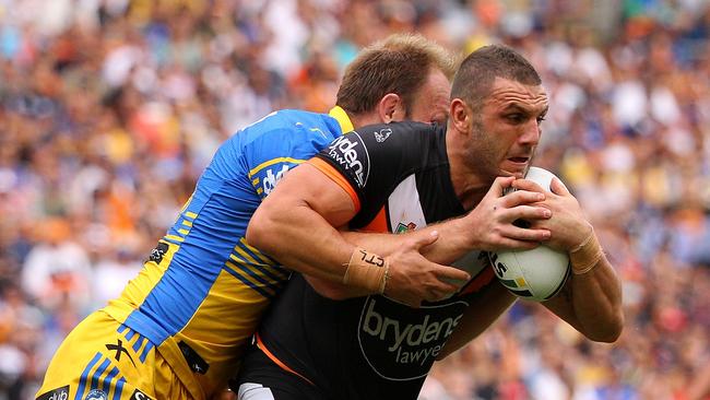 Robbie Farah is tackled during his return match against the Eels.