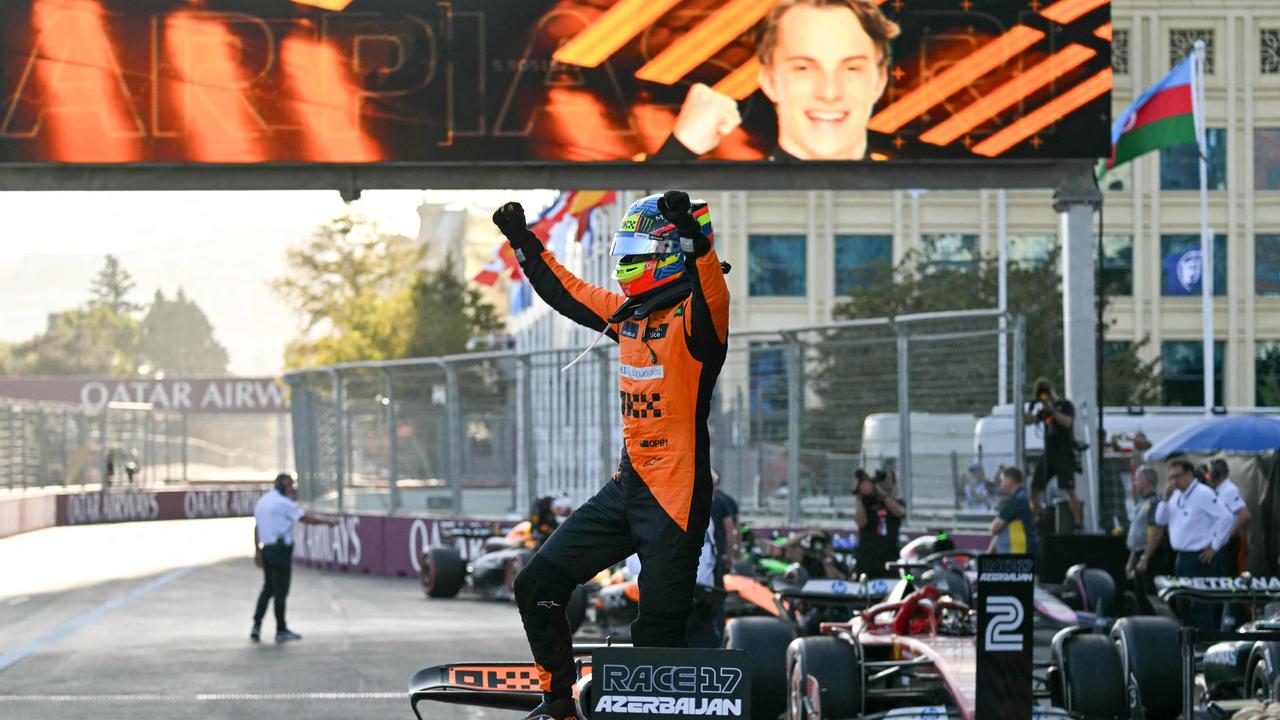 TOPSHOT - McLaren's Australian driver Oscar Piastri celebrates after winning the Formula One Azerbaijan Grand Prix at the Baku City Circuit in Baku on September 15, 2024. (Photo by Andrej ISAKOVIC / AFP)