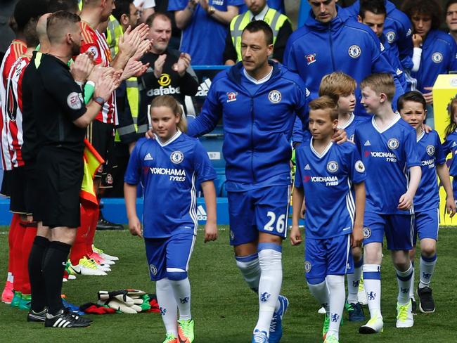 Chelsea's English defender John Terry leads the team out