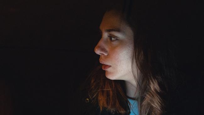 Mentally abused woman sitting in her car after running away from her partner in car domestic violence scared istock