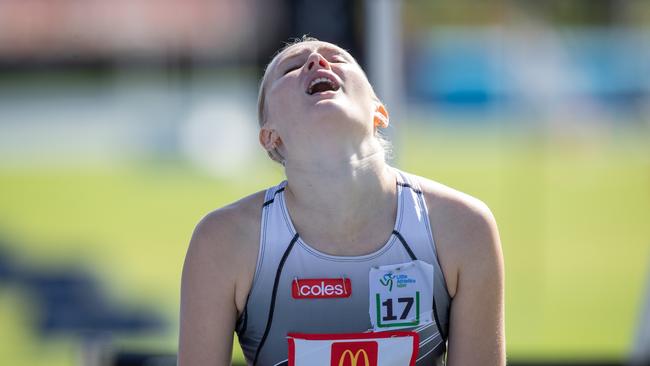 Inner West athlete Adelaide Marshall grimaces as she crosses the line in the U17 800m final. Pic: Julian Andrews.