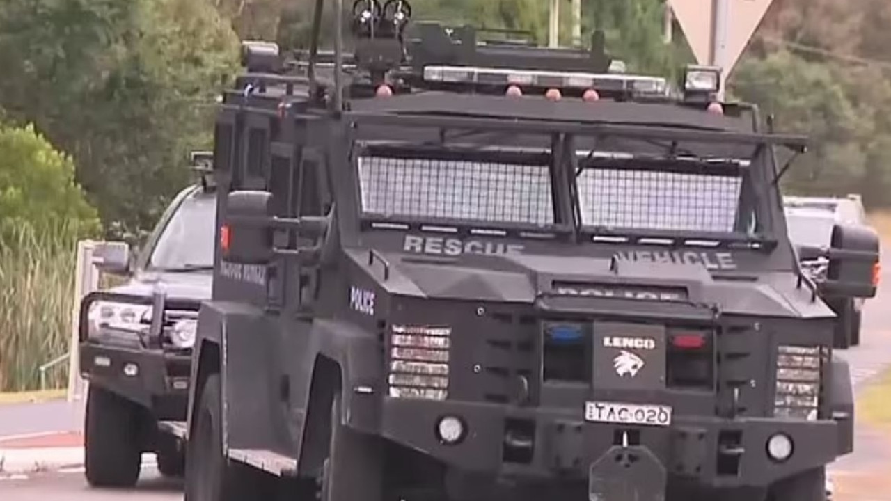 Tactical police officers in Varroville on Tuesday morning. Picture: Nine News