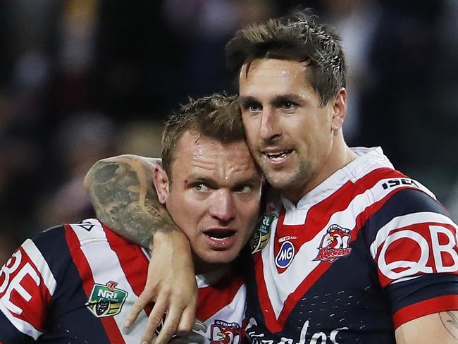 Jakob Friend and Mitchell Pearce of the Roosters react after winning the NRL qualifying final match between Sydney Roosters and Brisbane Broncos at Allianz Stadium in Sydney, Friday, September 8, 2017. (AAP Image/Daniel Munoz) NO ARCHIVING, EDITORIAL USE ONLY