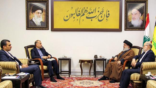 Hezbollah chief Hassan Nasrallah (2nd-R) meets Iran's Foreign Minister Hossein Amir-Abdollahian (2nd-L), Iran's assistant foreign minister Mehdi Shoushtari (L) and the deputy to Iranian ambassador to Beirut (R), at an undisclosed location in Lebanon. Picture: AFP.