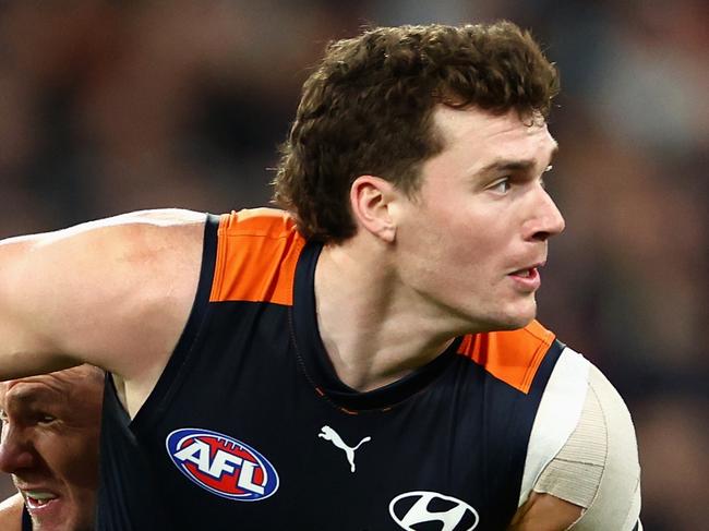 MELBOURNE, AUSTRALIA - JUNE 21: Blake Acres of the Blues is tackled by Patrick Dangerfield of the Cats during the round 15 AFL match between Carlton Blues and Geelong Cats at Melbourne Cricket Ground, on June 21, 2024, in Melbourne, Australia. (Photo by Quinn Rooney/Getty Images)