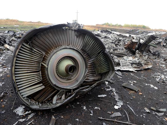 (FILES) In this file photo taken on September 09, 2014 shows part of the Malaysia Airlines Flight MH17 at the crash site in the village of Hrabove (Grabovo), some 80km east of Donetsk. Moscow on May 24, 2018 rejected an international investigation that found a Russian missile downed flight MH17 over Ukraine in 2014, saying no such weapon had ever crossed the Russian-Ukrainian border.  
