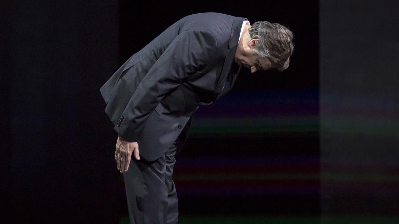 Nissan Motor Co. Executive Vice President Daniele Schillaci bows in apology at the begining of a press conference at the Tokyo Motor Show. Picture: Getty Images