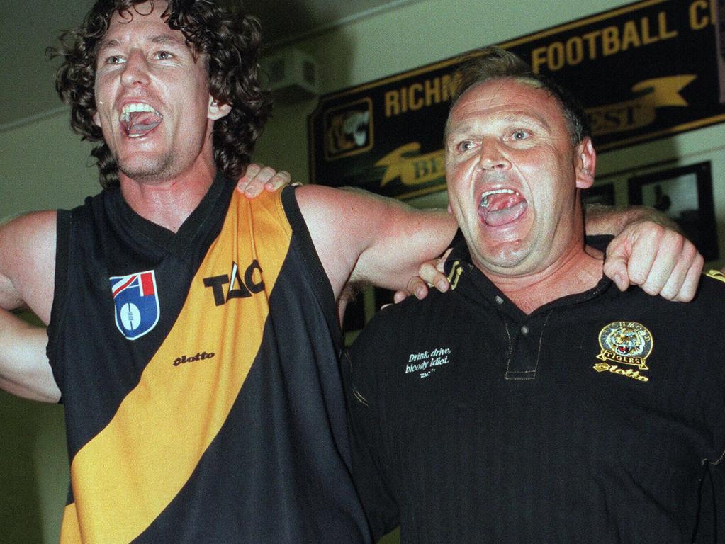 29/03/1998:  Richmond coach Jeff Gieschen (right) and Paul Bulluss shout hard the song. Richmond v Essendon. p/  /afl