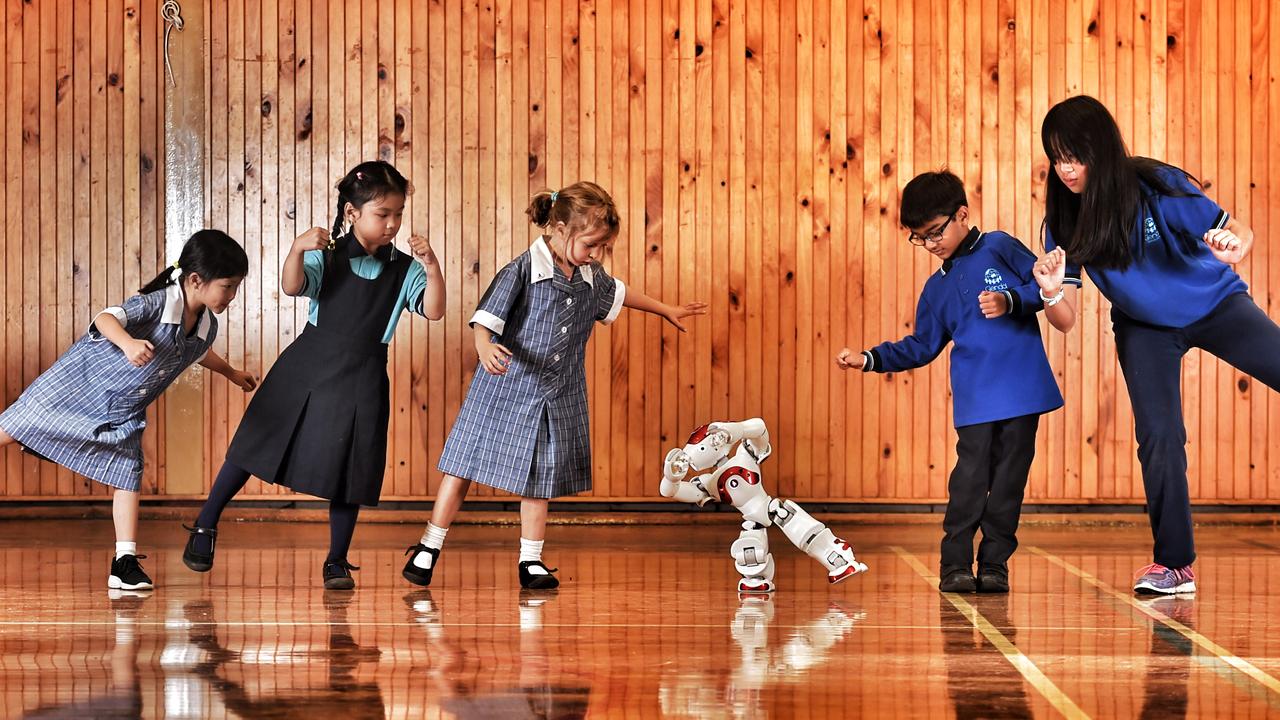 Preps at Glendal Primary dance with their robot. Picture: Tony Gough