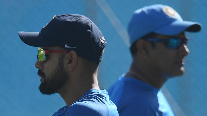 India's captain Virat Kohli (L) walks past coach Anil Kumble during the Indian team's training session at the Maharashtra Cricket Association Stadium in Pune on February 22, 2017. India will play a four match Test series against touring Australia with the first Test scheduled to start in Pune from February 23. ----IMAGE RESTRICTED TO EDITORIAL USE - STRICTLY NO COMMERCIAL USE----- / AFP PHOTO / INDRANIL MUKHERJEE / ----IMAGE RESTRICTED TO EDITORIAL USE - STRICTLY NO COMMERCIAL USE----- / GETTYOUT
