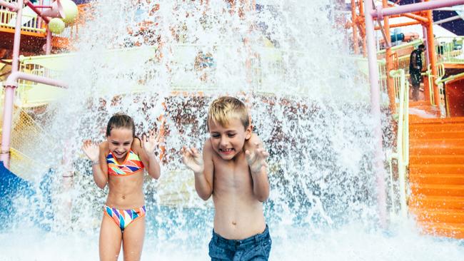 Children playing in water in Pipeline Plunge. A cash splash from the park’s parent company will inject new life into the park.