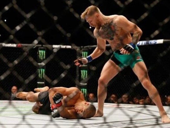 McGregor stands over his fallen victim.