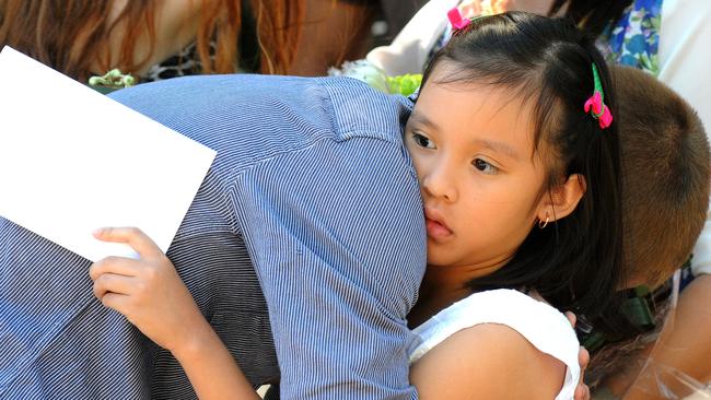 Rihanna Milabo hugs Luke Robinson. Picture: John Gass