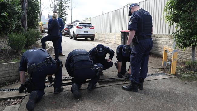 Police return to the Auburn Road crime scene on Tuesday. Picture: John Grainger