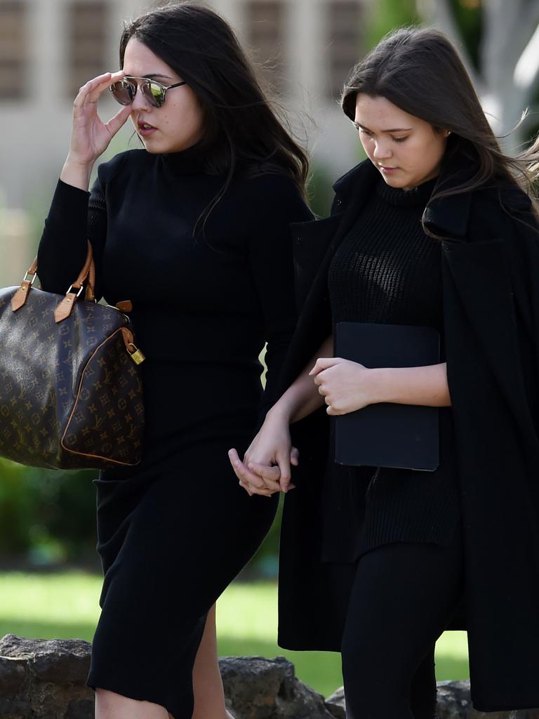 Carl Williams' daughter Dhakota (right), and stepdaughter Breanane, arrive at the funeral of Carl's father George in 2016.