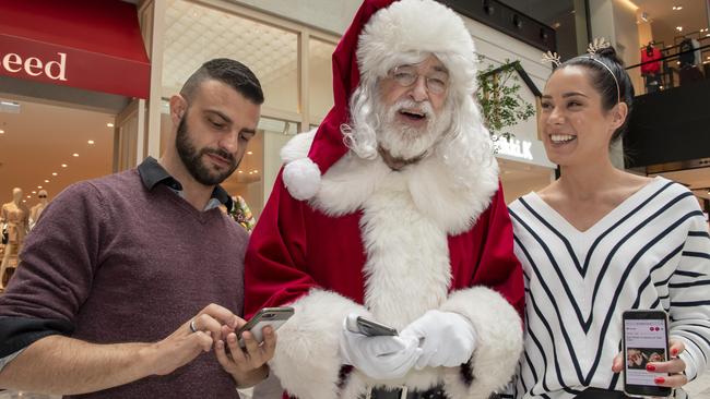 Leigh and Stevie with Santa at The Glen. Picture: Andy Brownbill