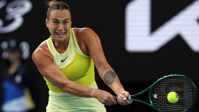 Belarus' Aryna Sabalenka hits a shot against USA's Sloane Stephens during their women's singles match on day one of the Australian Open tennis tournament in Melbourne on January 12, 2025. (Photo by Adrian Dennis / AFP) / -- IMAGE RESTRICTED TO EDITORIAL USE - STRICTLY NO COMMERCIAL USE --