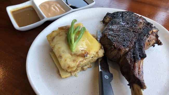 The grilled ribeye and sauces.