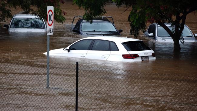 Robina is flood prone — flood waters enter in the parking lot outside the Robina Hospital on the Gold Coast. AFP PHOTO.