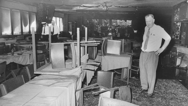 Police Inspector Les Bardwell investigates the damage at the Whiskey Au Go Go nightclub in Fortitude Valley, Brisbane, in 1973.