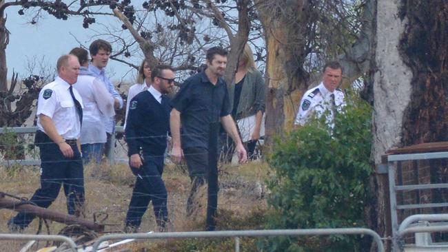 Accused Gene Bristow, centre, with sheriffs officers on his property in Meningie during a jury visit. Picture: AAP / Brenton Edwards