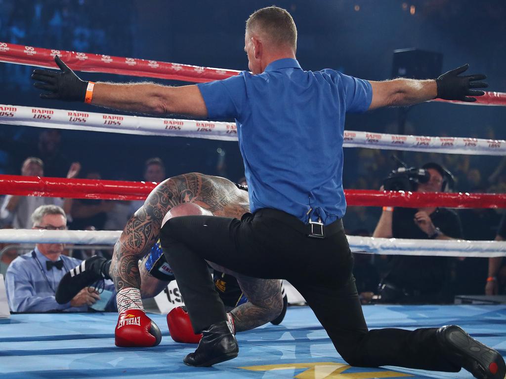 The referee waves off the bout as Lucas Browne battles to get back to his feet. (Photo by Mark Metcalfe/Getty Images)