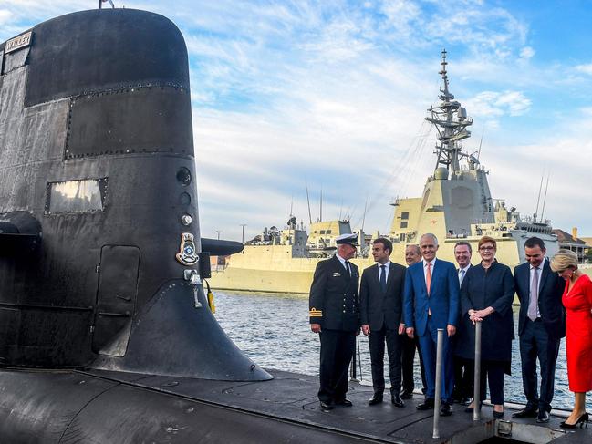 French President Emmanuel Macron (2/L) and Australian Prime Minister Malcolm Turnbull (C) standing on the deck of HMAS Waller. Picture: AFP